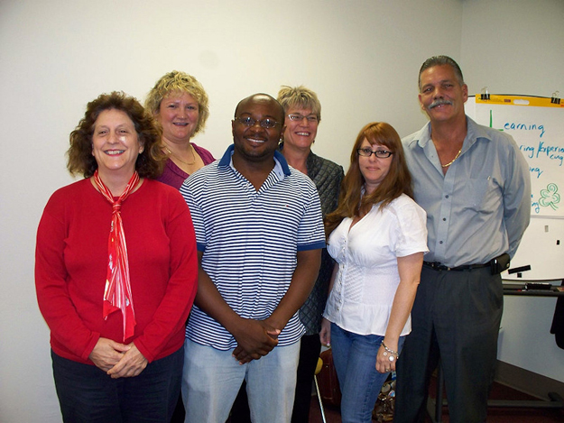 Team Leaders pose with CQL reps during Area 10's LENS workshop. From left, Shirley Board, Anne Buechner, Lawrence Walters, Jill Westring, Amy Reyna, and Jorge Viega