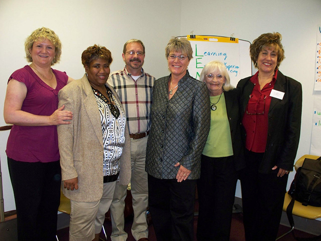 APD employees celebrate the LENS workshop's success with CQL participants. From left, Anne Buechner, Cora Brown, David Gillis, Jill Westring, Bonnie Florom, and Kathy Coleman