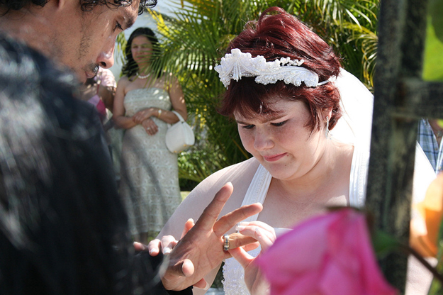 Sharon Marie Breadon places a ring on the finger of her new husband, Victor Colon, during a ceremony in their Miami Lakes home. Both are APD customers