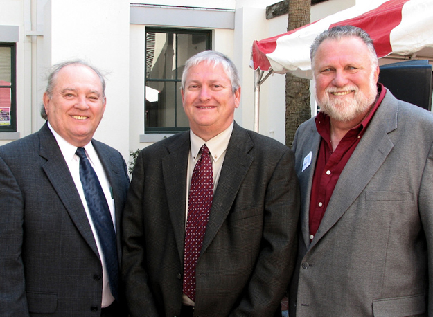 APD Director Jim DeBeaugrine, center, visits with Arc representatives Paul Sweeney, left, and Michael Messer