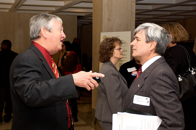 APD Director Jim DeBeaugrine, left, and Enrique Escallon of the FDDC chat during Developmental Disabilities Day at the Capitol