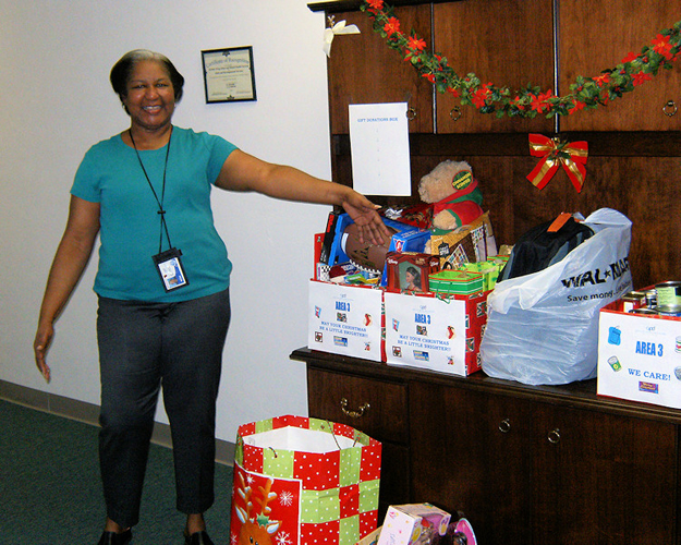 Area 3 employee Jessie Williams feels good about the gift and food donations that the office donated to the United Way.