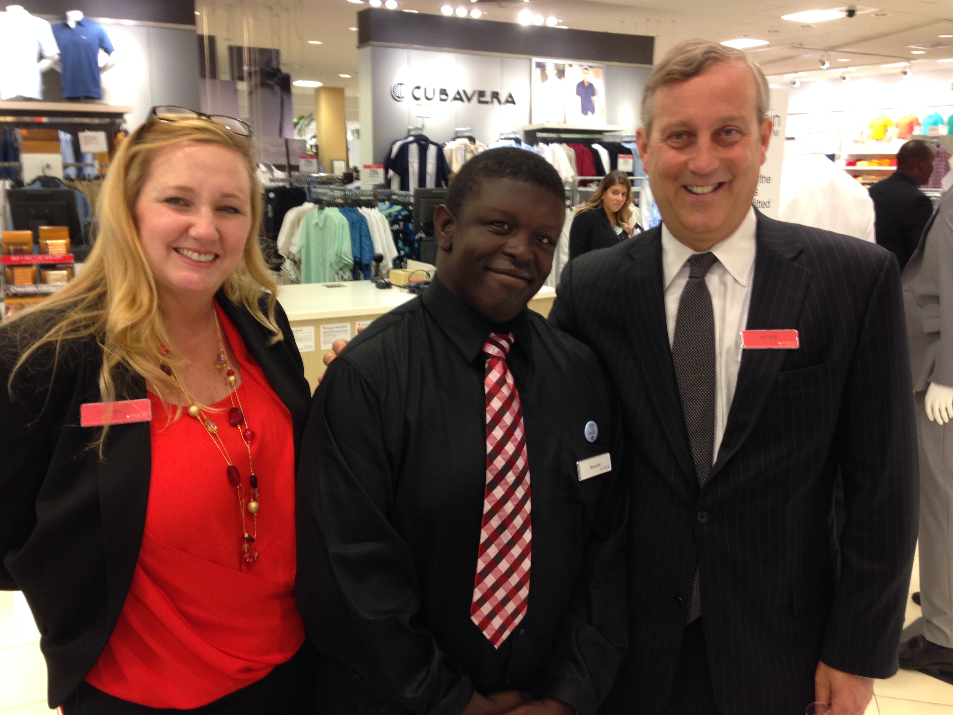 Brandon Jackson (center) with Macy’s Store Manager Kathy Clarke and Macy’s President Peter Sachse at the Boca Raton store.
 