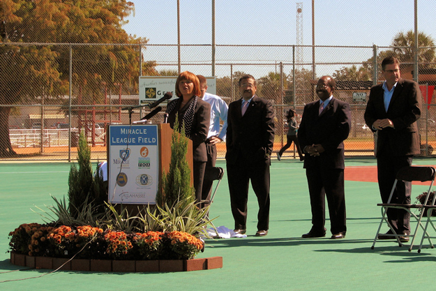 Tallahassee City Manager Anita Favors Thompson emcees the dedication ceremony for Leon County first Miracle Field. Behind her, from left, are Leon County Commission Chairman Bryan Desloge, Tallahassee Mayor John Marks, State Rep. Curtis Richardson, and Tallahassee Director of Parks, Recreation, and Neighborhood Affairs Dee Crumpler.