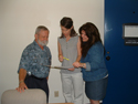 Area Administrator Eric Olsen, Program Supervisor Heather Monteath, and Administrative Secretary Kelly McDavid discuss a project