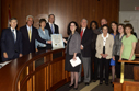 Governor Crist formally presents the Cabinet Resolution to APD employee Katie Bowman.  From left, Attorney General Bill McCollum, Gov. Crist, CFO Alex Sink, Agriculture Commissioner Charles Bronson, Bowman, APD Director Jim DeBeaugrine, Blind Services Deputy Director Stephanie Wilson, VR Director Bill Palmer, Able Trust President and CEO Sue Homant, APD Communications Director Melanie Mowry Etters, Able Trust VP of Grant Programs Guenevere Crum, and VR Communications Director Rachel Smith