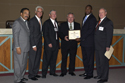Kmart's award presentation: from left, Tallahassee Mayor John Marks, Gov. Crist, APD Director Jim DeBeaugrine, Kmart West Palm Beach District Manager Ken Morris, Kmart Regional Manager Dave Rodney, and VR Director Bill Palmer