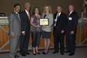 Martin Electronics' award presentation: from left, Tallahassee Mayor John Marks, Gov. Crist, Martin Electronics Assistant HR Manager Margie Walsh, Martin Electronics VP of Administration Suzanne Sleigher, APD Director Jim DeBeaugrine, and VR Director Bill Palmer