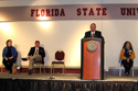 The presenters share the stage at FSU's celebration.  From left, FSU Associate Dean of Students Robin Leach, FSU ADA Coordinator Andy Snuggs, APD Director Jim DeBeaugrine, and FSU student Beth Taurasi
