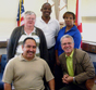 Four DMD mentees visit with Suncoast Area Administrator Carl Littlefield. Clockwise from lower left, Carlos Pomales, Larry Chaney, Kevin Eaton, Rosa Seales, and Littlefield