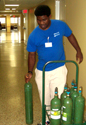 Lawrence Jones, the first Project Search participant to land a job at Baptist Hospital, delivers oxygen tanks throughout the facility