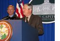 APD Director Jim DeBeaugrine speaks at a news conference after signing the Champions for Children agreement.  Lt. Gov. Jeff Kottkamp listens.