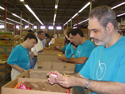 Participants of Alliance Support Corp.'s adult day program sort food during one of their monthly food drives for the Second Harvest Food Bank of Central Florida.