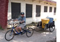 Hugh Fay tours the Sunland campus on his bike-and-cart rig to gather recyclable materials---his favorite job at the center.