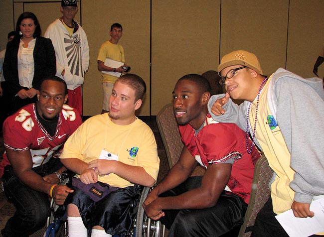 FSU Linebacker Dakoda Watson and Defensive Back Ochuko Jenije pose for photos with YLF attendees