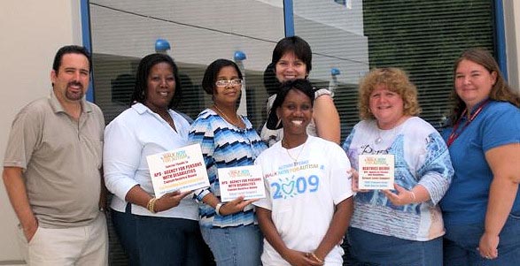 Area 15 staff proudly pose with their awards from Autism Speaks. From left, Area Administrator Peter Karlan, Mary Edwards, Beatrice Dejoie, Olga Kramskaya (back), Alesia Weeks (front), Noreen Ruffolo, and Tracy Jahn