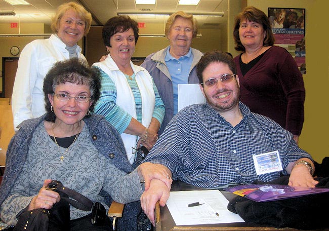 Members of the Family Care Council pose for a photo during the iBudget forum in Tampa. Standing, from left, Pauline Lipps, Betty Kay Clements, Betty Beauchaine, and Ann Graybeal. Seated, Sara Ciccarello and her son Peter Ciccarello