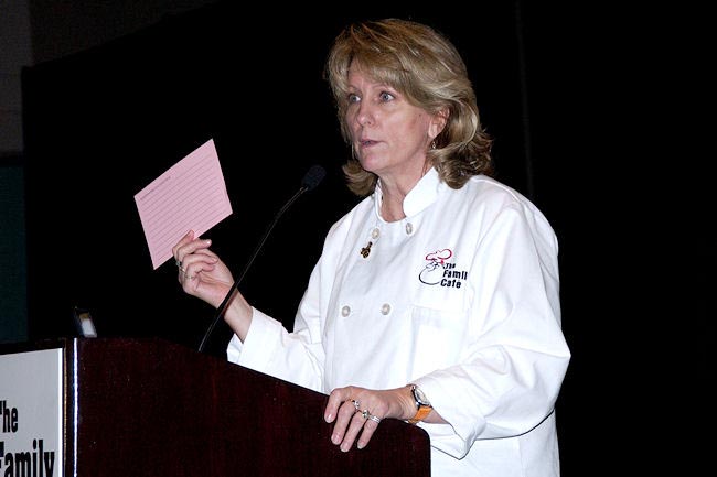 Family Café President and CEO Lori Fahey reminds conference attendees to fill out their "pink cards." The cards give participants a chance to ask questions. The answers from agencies and organizations are published later by the Family Caf in The Question and Answer Book