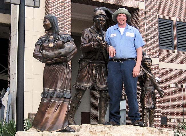 APD Customer Eric Fletcher has some fun with the statues on the campus of Florida State University. He works in FSU's University Center Club. 