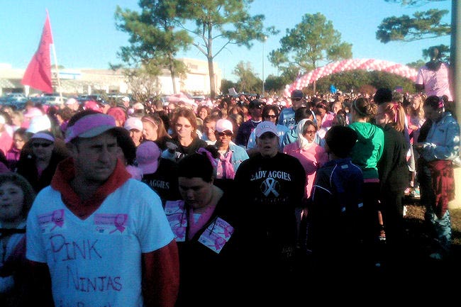 A mob of volunteers walks the streets of Pensacola on October 31 for the American Cancer Society Breast Cancer Walk. The walkers include Pensacola APD-AmeriCorps member Nielah Spears and waiting list member Asharyii Nash