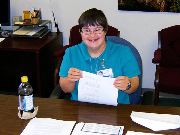 Ginny Reed keeps one step ahead of her paperwork at the Gainesville office of the Agency for Persons with Disabilities