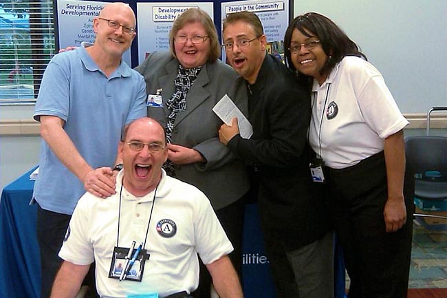 APD-AmeriCorps members and staff at the agency's Area 7 office in Orlando celebrate their success. Standing, from left, Richard Darnell, Maryjane Wysocki (staff), Manny Garay, and Janet Nunnelly. Seated, Jay Dyer