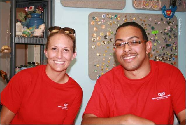 From left, APD AmeriCorps members Ashley Cooper-Heath and James Roman III volunteer at Family Fun Night, held July 30 at Ben's Place in Jacksonville