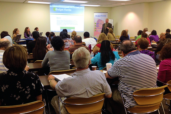 Art Barndt, standing, leads an iBudget Florida training session for waiver support coordinators at the Fort Lauderdale office of APD's Southeast Region.
