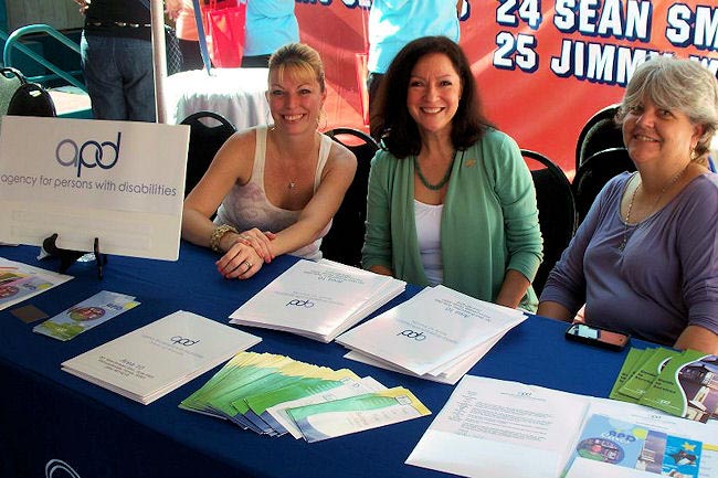 APD Area 10 employees greet the public at the Dan Marino Foundation's "WalkAbout Autism." From left, Kim Murray, Area Administrator Martha Martinez, and Pam Romack