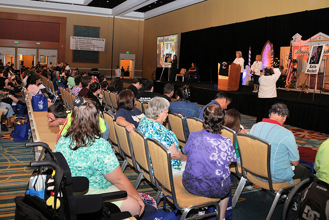 Family Caf President and CEO Lori Fahey, at lectern, welcomes attendees to the conference's opening session on June 15.