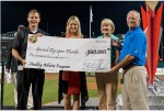 APD Director Mike Hansen and Attorney General Pam Bondi present a giant check representing the state’s $500,000 grant to Special Olympics Board Chair Sherry Wheelock and Special Olympics Florida CEO Monty Castevens.