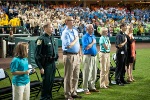Dignitaries all stand during the Pledge of Allegiance at the opening ceremony of the State Special Olympic Games.