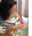Area 10 Administrator Martha Martinez proudly holds her first grandchild, Layla Elizabeth Caroscio.