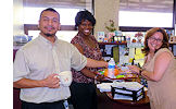 From left, Michael Fuentes, Glorie Singleton, and Fabiana Miranda serve up the continental breakfasts for fellow Suncoast Area staff members during Public Service Recognition Week.