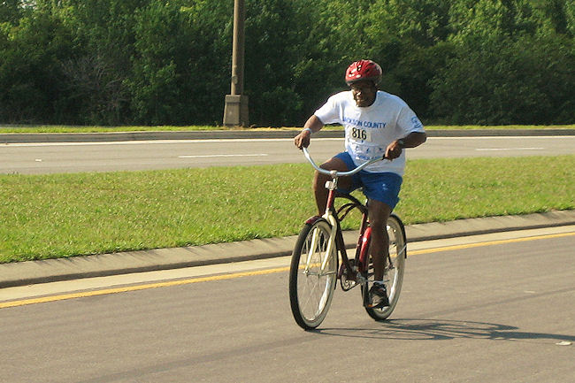 Gold Medalist Floyd Nelson of Sunland races towards the finish line in the cycling completion of the Florida Special Olympic Summer Games.
