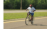Gold Medalist Floyd Nelson of Sunland races towards the finish line in the cycling completion of the Florida Special Olympic Summer Games.