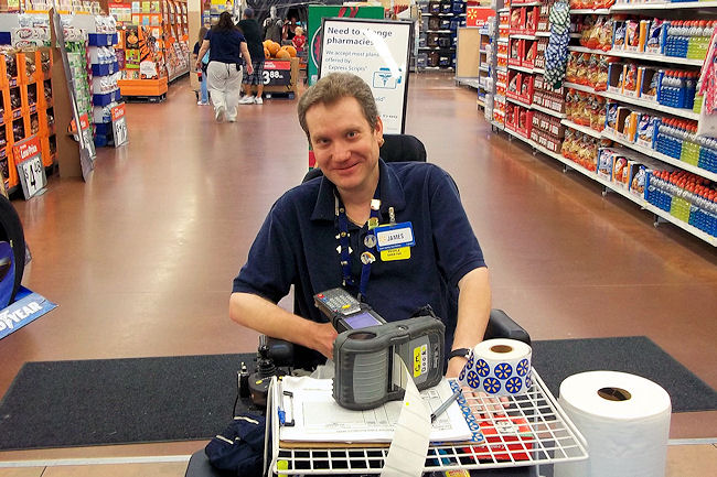 James Chillson is ready to help the next customer with a price check. He has worked as a greeter at the North Port Walmart for more than five years. 

