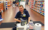 James Chillson is ready to help the next customer with a price check. He has worked as a greeter at the North Port Walmart for more than five years. 