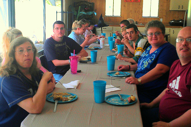 Mentees and Great Expectations Group Home staff members enjoy a meal served by mentors from Longhorn Steakhouse. It was part of an interesting and interactive mentoring session in observance of Disability Mentoring Day.