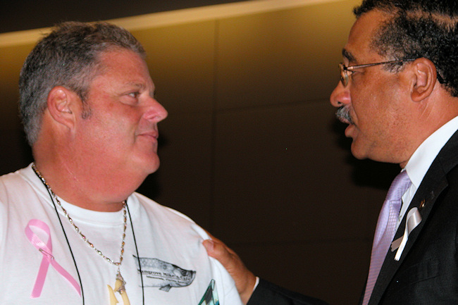 Mangrove Mikes Caf owner Mike Forster being congratulated by Mayor John Marks.
