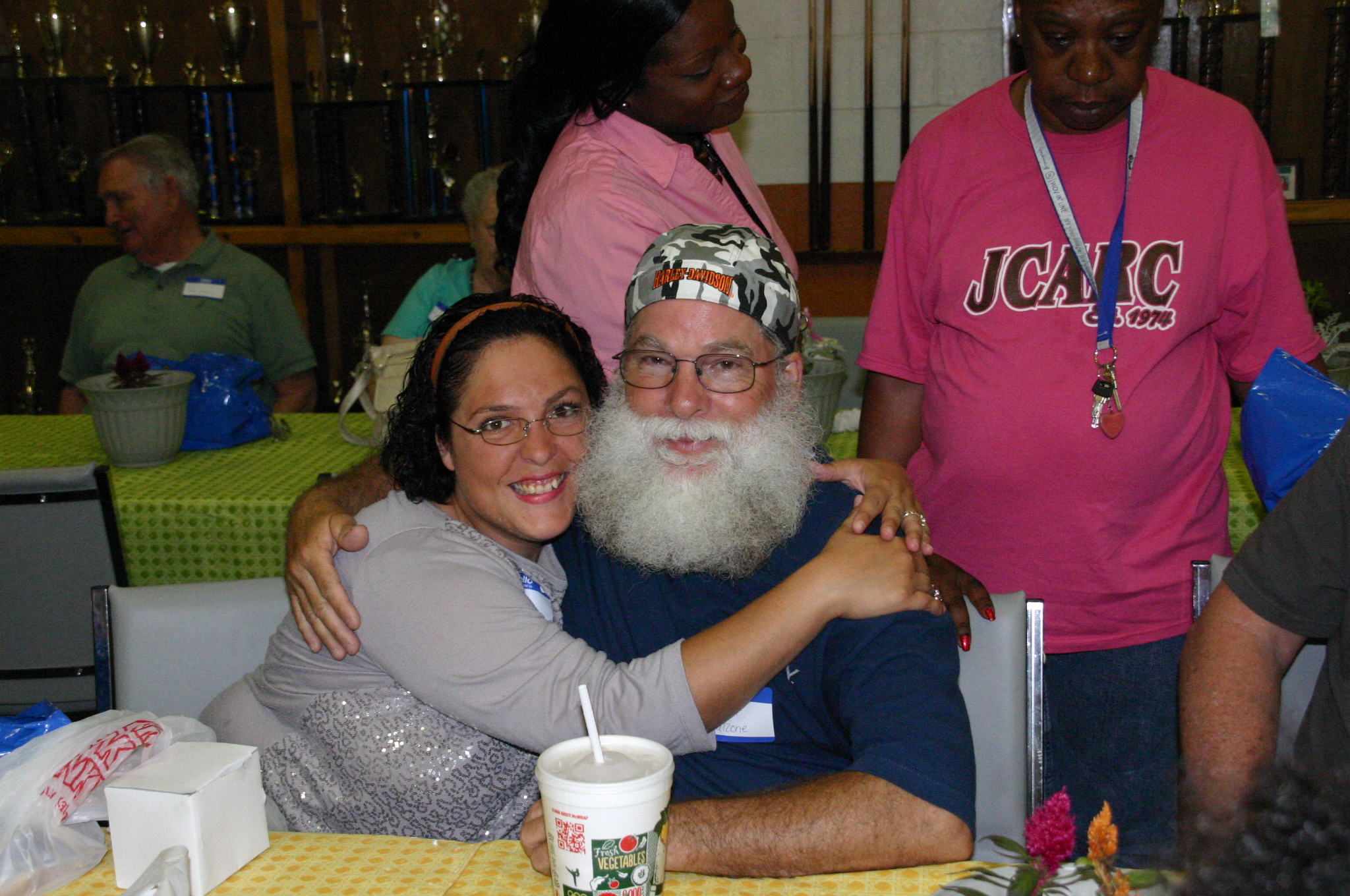Clarice F. gives her father a big hug for the camera 