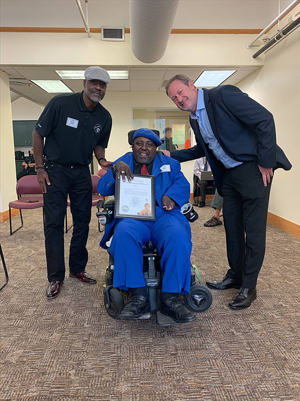 Arizona receives his commendation from Tampa City Council member Bill Carlson.