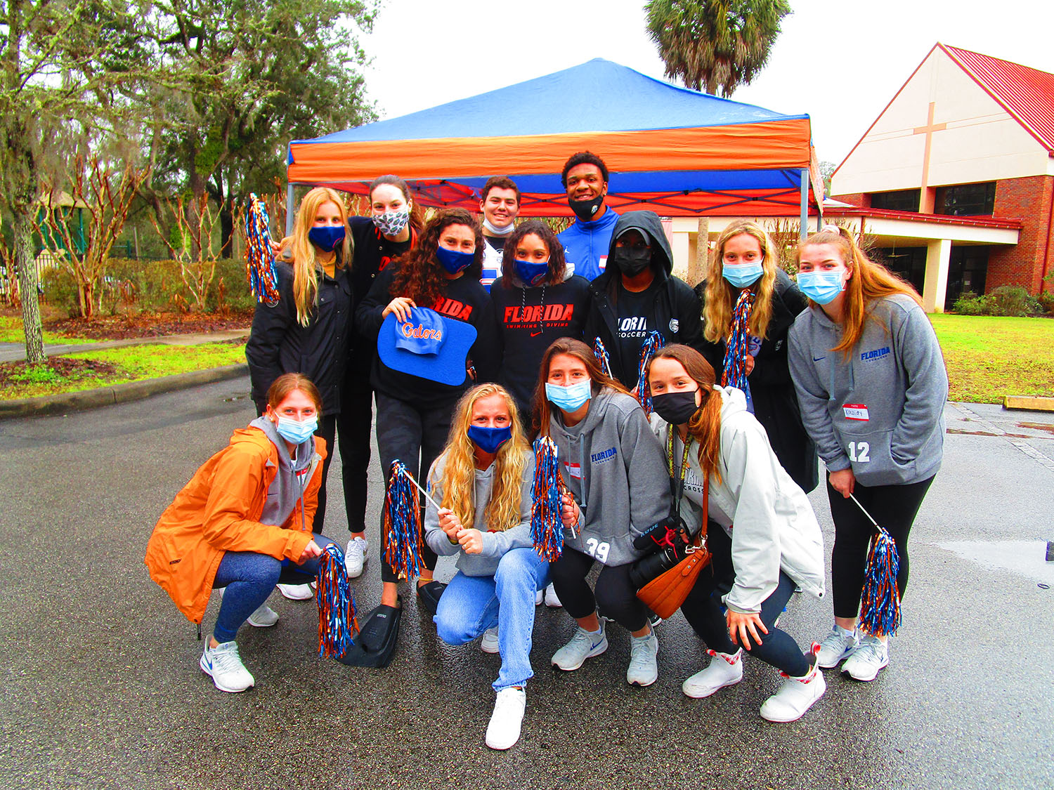 Vehicles lined up to drive the red carpet with participants being cheered along the way by University of Florida athletes, a drumline, cheerleaders, and many others who handed out goody bags, T-shirts, and hot chocolate.